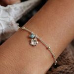 צמיד כדוריות עדין עם פרח פלומריה קן מכסף טהור 925 1.jpg